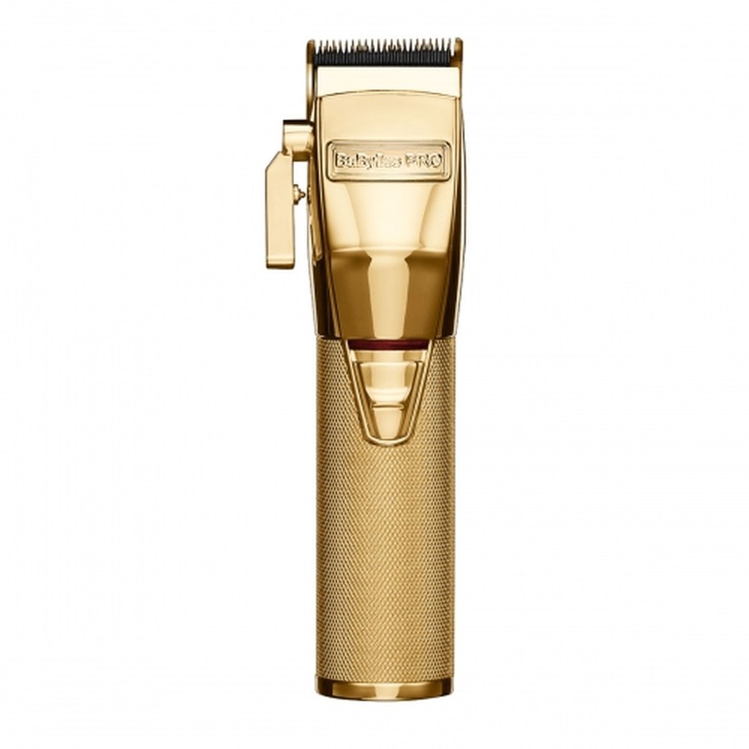 BaBylissPRO FX870 GoldFX cordless barber clipper with gold titanium blade on a cream background